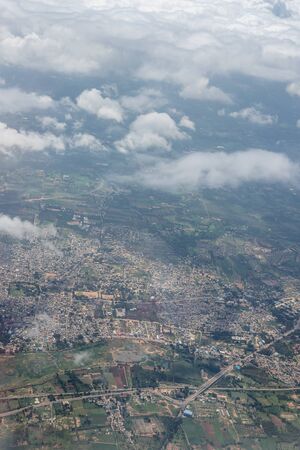 Bangalore to Pune,, a view of a city with a mountain in the backgroundの写真素材