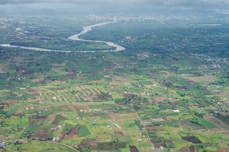 Bangalore to Pune,, a view of a city with a mountain in the background
