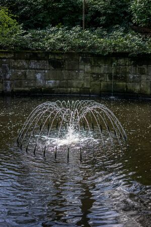 Flower garden, Netherlands, Europe, a bridge over a body of waterの写真素材