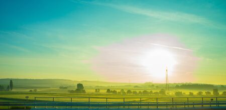 Germany, Frankfurt, Sunrise, Outkirts, a rainbow over a field