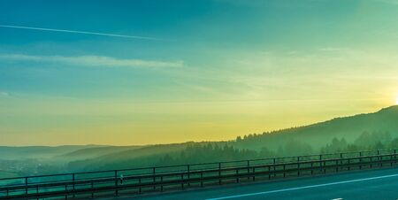 Germany, Frankfurt, Sunrise, Outkirts, a bridge over a body of water