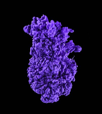 Purple ink in water. Abstract paint. On black backgroundの写真素材