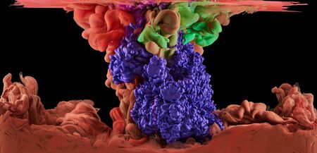 Fantastic mixing paint under water. Ink on black backgroundの写真素材