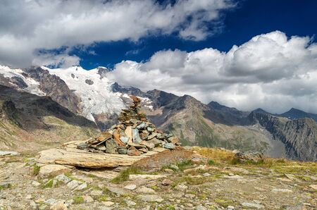 Ritual pyramid on the trek to Monte Rosa, Alps, Italyの写真素材