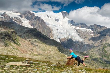 Happy girl at Alpine landscape, Italy, Monte rosaの写真素材