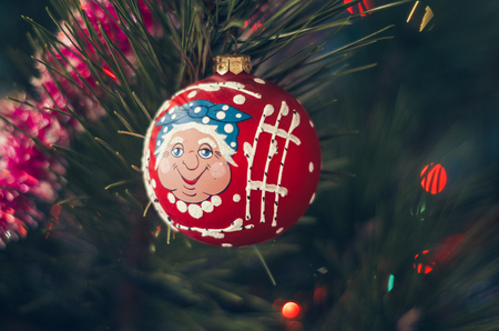 Closeup of Christmas ball from Christmas tree with colored lights.の写真素材