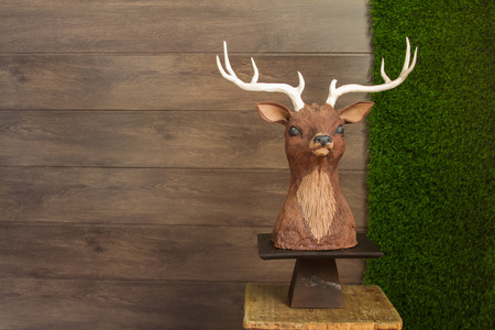 Beautiful tiered birthday cake on a dark wooden background.の写真素材