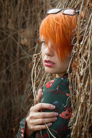 Beautiful girl with short red hair.の写真素材