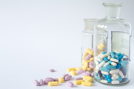 the medical pills are on a moneyの写真素材