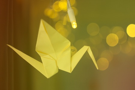 Decorated origami cranes on xmas backgroundの写真素材