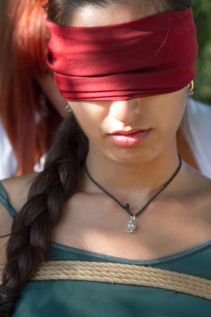 Shibari in nature in summer. Bound young girl.の写真素材