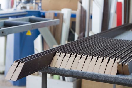 Furniture accessories. Manufacture of skirting boards in a furniture factory.
