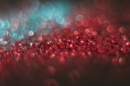 abstract defocused round shaped green and red lights on black backgroundの写真素材