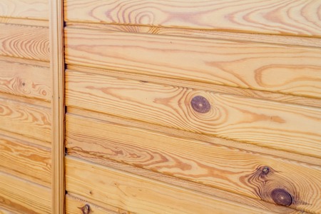 Closeup of wooden boards fastened by a cross bar, background or concept, the theme of environmental friendliness.の写真素材