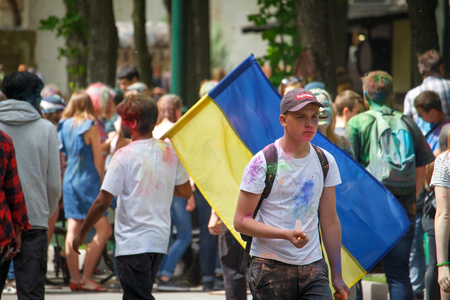KHARKIV, UKRAINE - MAY 19, 2018: happy people celebrate Holi color festival. Indian festival of color in the park in Kharkiv, Ukraine, MAY 19, 2018のeditorial素材