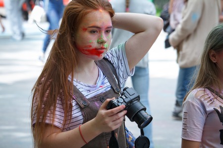 KHARKIV, UKRAINE - MAY 19, 2018: happy people celebrate Holi color festival. Indian festival of...