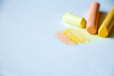 Colorful chalk pastels on a white background, arts, education, creative, back to school, free space for textの写真素材