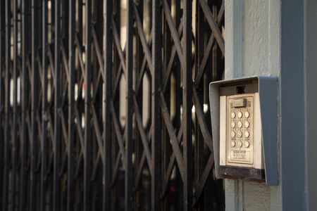 Paris, France - July 06, 2018: Push-button coded lock on the door and grill on the windowsのeditorial素材