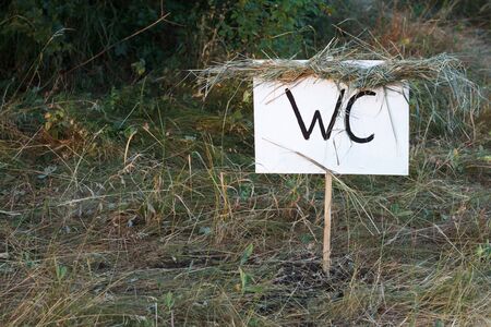 Simple design handmade wooden sign of toilet give direction to WCの写真素材