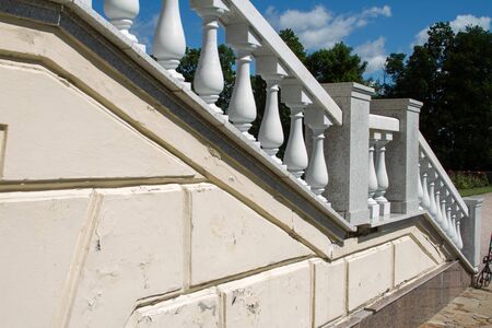 Old white stone staircase with classic balusters, descent into the English garden, copy spaceの写真素材