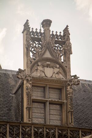 Paris, France - July 7, 2018: Architectural details and emblems of faculties on the roof of the...