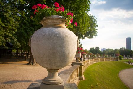 Paris, France - July 7, 2018: Luxembourg gardens ornamental statue, tropical flowers and trees in flowerpots and tubsのeditorial素材