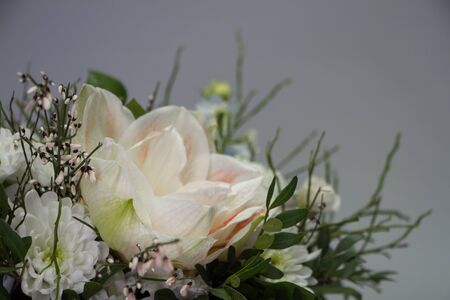 Close up bright floral arrangement in pastel colors in a hat box, greeting concept