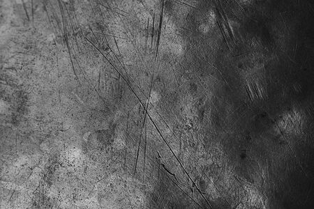 Brushed brass plate backdrop texture, metal surface with scratches and dents, selective focus