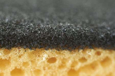 Abstract background yellow sponge for washing dishes closeup, selective focusの写真素材
