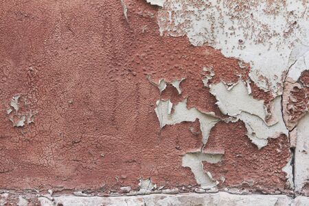 Old flaky cracked paint on grey wall, old paint background, selective focusの写真素材