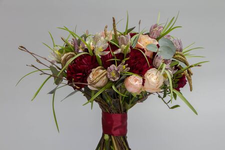 Beautiful bouquet in vintage style, light grey background, selective focusの写真素材