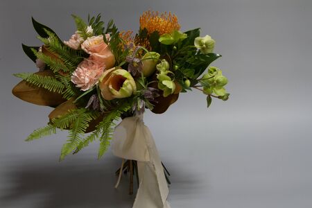 Wedding or greeting bouquet in vintage style, light grey background, selective focusの写真素材