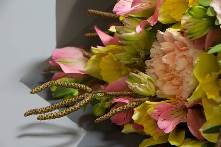 Beautiful bouquet in vintage style, light grey background, selective focusの写真素材