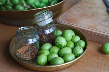 Step-by-step recipe for preparing of homemade Italian liquor nocino from green walnuts, real home kitchen and cooking, selective focusの写真素材