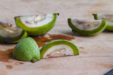 Step-by-step recipe for preparing of homemade Italian liquor nocino from green walnuts, real home kitchen and cooking, selective focusの写真素材