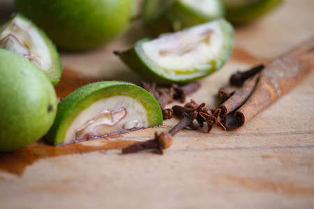 Step-by-step recipe for preparing of homemade Italian liquor nocino from green walnuts, real home kitchen and cooking, selective focusの写真素材