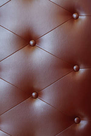 Red leather texture decorate backdrop, coach coupler on black leather, selective focusの写真素材