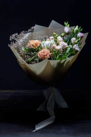 Beautiful summer bouquet in bright colors, grey backdrop, selective focusの写真素材