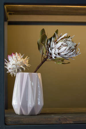 Florist shop modern interior, shelves with vases of dried flowers, bouquets of dried flowers, selective focusの写真素材