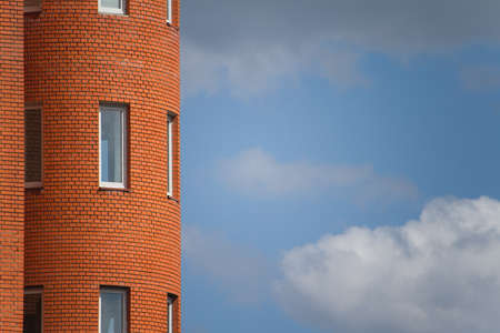Close up of architectural details and window of an old building against the blue sky, background or conceptの写真素材