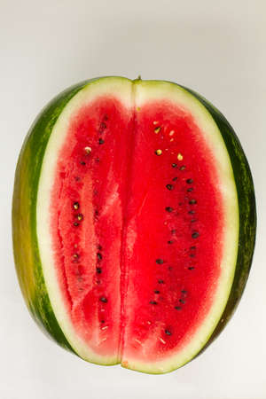 Sliced ripe red watermelon on white background, top viewの写真素材