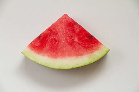 Slice of ripe red watermelon on white background, top viewの写真素材