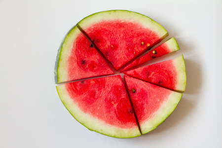 Few slices of ripe red watermelon on white background, top viewの写真素材