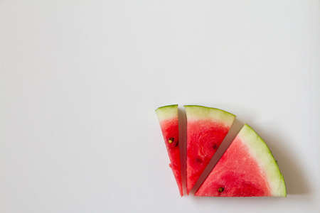 Few slices of ripe watermelon on white background, top view