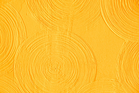Closeup yellow abstract background gypsum panel, spiral shaped volumetric, yellow circles, futuristic background, selective focusの写真素材