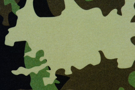Camouflage fabric in green tones, background or screensaver, selective focusの写真素材