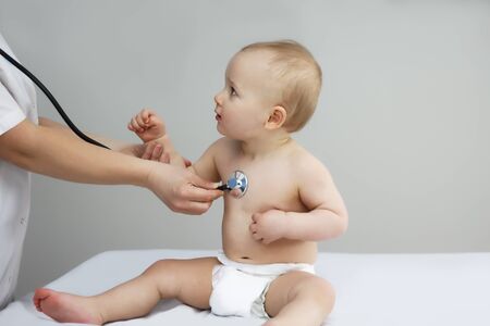 the little boy doctor listens to the heartbeat