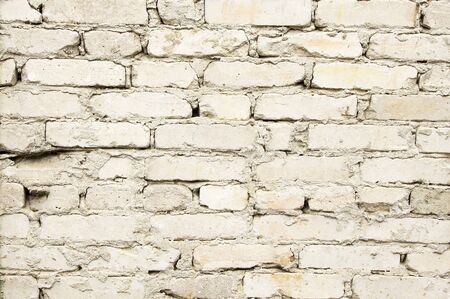 Texture of an old brick white wallの写真素材