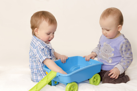 Children play with toy on white backgroundの写真素材