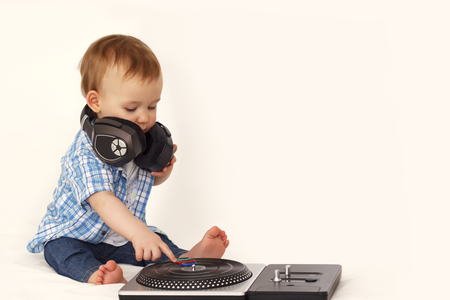 little boy in headphones with remote controlの写真素材
